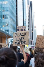 Protester holding up Black Lives Matter Sign during Juneteenth March, Midtown,