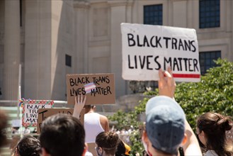 Protesters holding up Black Trans Lives Matter Signs during Protest outside Brooklyn Museum, Brooklyn,