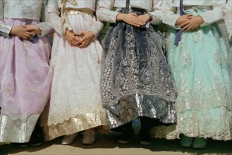Waist-Down View of Young Women wearing Hanbok Dresses and Sneakers, Gyeongbokgung Palace,