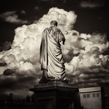 Rear View of Roman Statue with Clouds in Background, Vatican City,