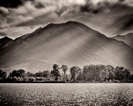 Mountain and Lake with Dramatic Sky and Shadows,,