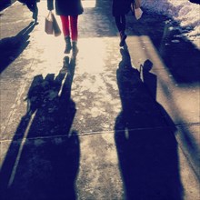 Rear View of Two People Walking on Sidewalk, New York City,