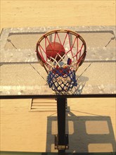 Low Angle View of Basketball Hoop and Ball,,