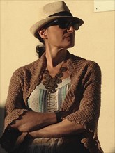 Half-Length Portrait of Mid-Adult Woman wearing Hat and Sunglasses,,