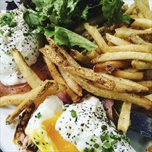 Poached Eggs, French Fries and Lettuce,