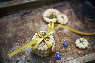 Small Stack of Shortbread Cookies with Bow Tie, Edible Flowers and Gold Sugar,