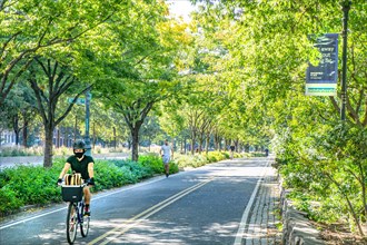 Cyclists and Joggers on Bike and Jogging Path along West Side Highway, New York City,