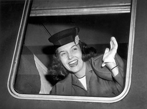 American Actress Shirley Molohon waving Goodbye as she departs Chicago for Hollywood and work in International's "Dark Mirror"