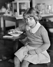Drought Victim eating Lunch furnished by American Red Cross, Duncan Consolidated School