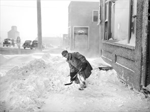Man Shoveling Snow on Sidewalk, Draper