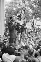 U.S. Attorney General Robert Kennedy speaking to a crowd of African Americans and whites through a Megaphone outside Justice Department Washington, D.C.