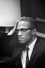 Malcolm X waiting at Martin Luther King Press Conference, Head and Shoulders Portrait