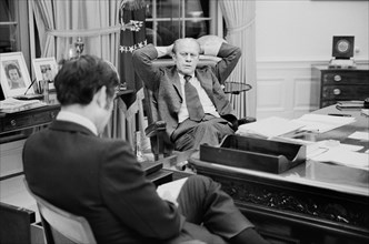 U.S. President Gerald Ford talking with aide John Mashek, at the White House