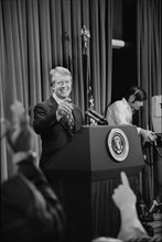 U.S. President Jimmy Carter at a press conference, taking a question