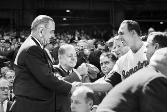 U.S. President Lyndon Johnson shaking hands with Washington Senators Manager Gil Hodges during opening day Game, Washington