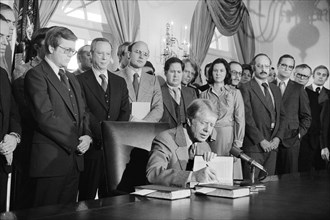 U.S. President Jimmy Carter signing copies of Federal Budget, Oval Office