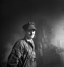 Welder employed in the Roundhouse at a Chicago and Northwestern Railroad Yard