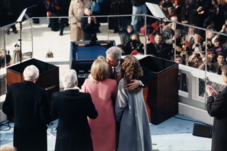 U.S. President Bill Clinton embracing his daughter