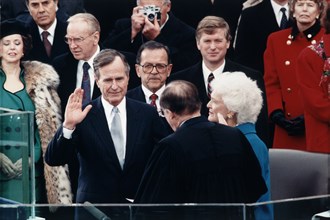Chief Justice William Rehnquist administering Oath of Office to George Bush on west front of U.S. Capitol
