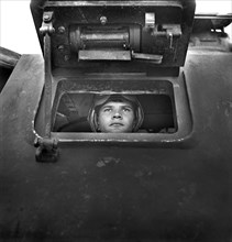 Sergeant George Camblair learning to drive a Tank