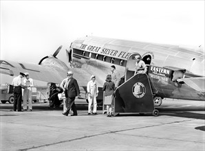 Passengers disembarking Airplane