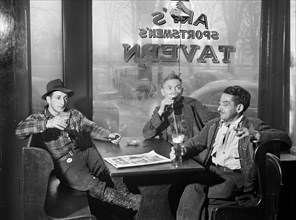 Three Men having Beer in Art's Sportsmen's Tavern on rainy day