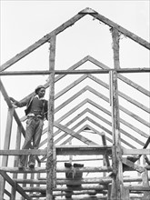 Man Rebuilding his Home outside the area of Santee-Cooper Basin