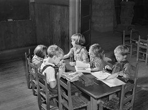 Young Students studying at Table in Rural Classroom
