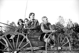 Rural Rehabilitation Family traveling in Horse-drawn Cart