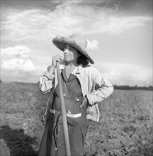 Member of Allen Plantation Cooperative Association resting from hoeing Cotton
