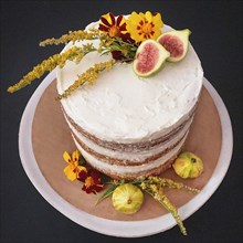 Vanilla Layer Cake Decorated with Edible Fresh Flowers and Fruit