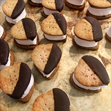 Heart-Shaped S'mores on Baking Sheet with Parchment Paper