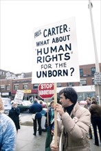 Protesters holding Anti-Abortion Signs