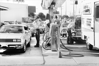 Cars lined up at Gas Station