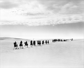 Military on Horseback in Desert