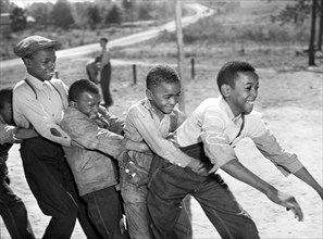 Group of Young Schoolboys playing during Recess