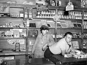 Mr. Coley and his Helper inside his General Store
