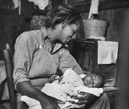 Migrant African-American Cotton Picker and her Baby