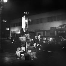 Newsstand and Traffic Light at Night