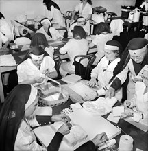 American Red Cross Women wrapping Bandages