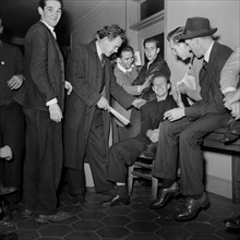 Group of Young Men waiting to Enlist at U.S. Navy Recruitment Headquarters