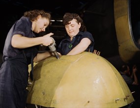 Two Woman working on "Vengeance" dive bomber