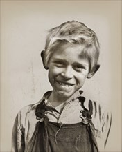 Son of cotton picker living in squatters' camp near Farmersville