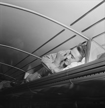 Soldier sleeping in Baggage Rack on Greyhound Bus going from Cincinnati