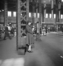 Member of Women's Army Auxiliary Corps waiting for train