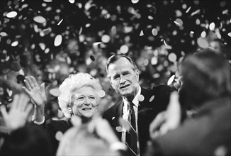 U.S. President George H.W. Bush and his wife Barbara Bush acknowledge crowd during Republican National Convention