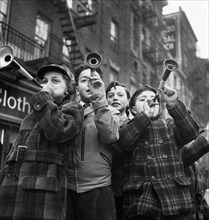 Four Boys blowing horns on New Year's Day