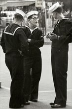 Three Sailors standing on Street Corner