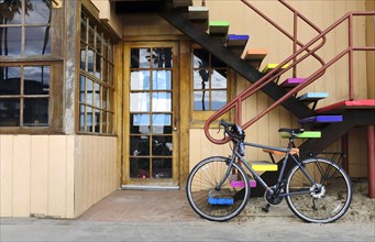 Bicycle leaning against Colorful Steps