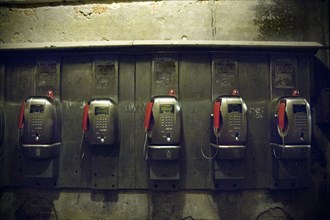 Row of Pay Telephones at Night